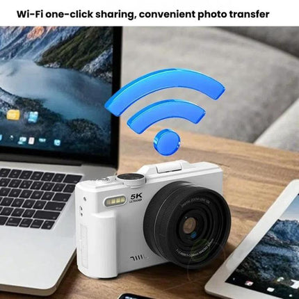 W1 Digital Camera with Flip Screen for Everyday Photography showing white camera on desk near laptop and tablet with Wi‑Fi icon indicating one‑click photo sharing