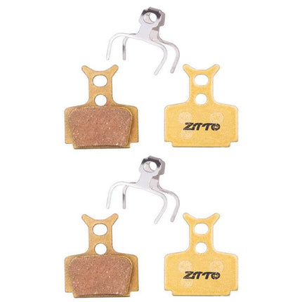 ZTTO Mountain Bike Brake Pads Full Metal Copper Base showing four copper-backed pads and springs for reliable, low-noise braking in wet or dusty conditions
