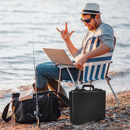 Portable Storage Box for Starlink Mini Handheld Accessories shown on a beach next to a traveler’s chair and laptop
