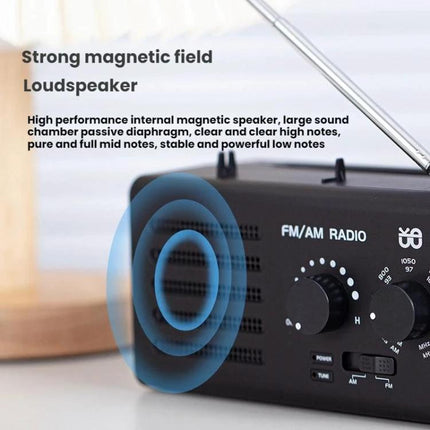 Portable Dual-Band FM and AM Radio with External Power Socket black compact unit showing speaker grille, tuning knobs and extended antenna