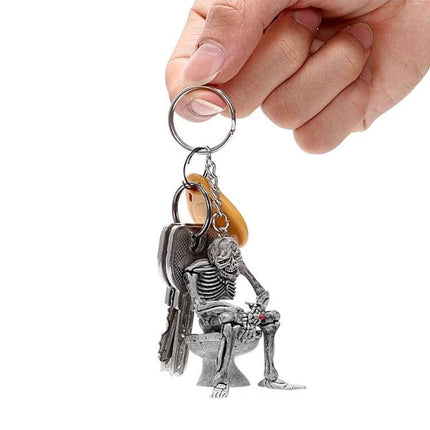 FORAUTO Skull Car Key Ring For Key Fob And Bag Decor - metal skull on toilet keychain held by hand, durable rubber accents, 5.4cm x 4.4cm