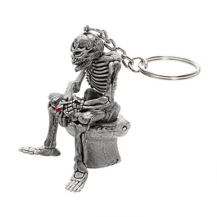 FORAUTO Skull Car Key Ring For Key Fob And Bag Decor - silver rubber skull keyring sitting on toilet charm for keys and bags, 5.4cm x 4.4cm, durable flexible design
