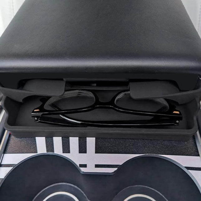 Silicone Armrest Glasses Storage Pocket for Tesla Cars holding black eyeglasses under center console armrest, nano-adhesive mounted, no-residue silicone pocket