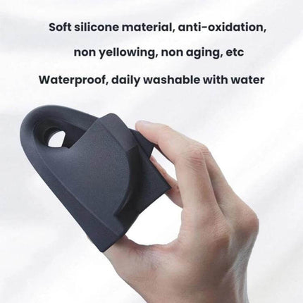 Silicone Armrest Glasses Storage Pocket for Tesla Cars - hand holding black soft silicone, waterproof, washable armrest eyewear holder