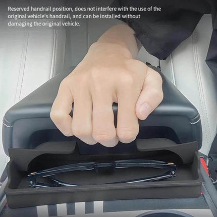 Silicone Armrest Glasses Storage Pocket for Tesla Cars showing sunglasses stored under armrest with hand on armrest