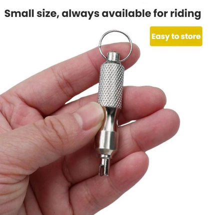 Essential Wrench for Everyday Vehicle and Bike Upkeep compact valve core wrench on keyring held in hand for roadside tire repairs