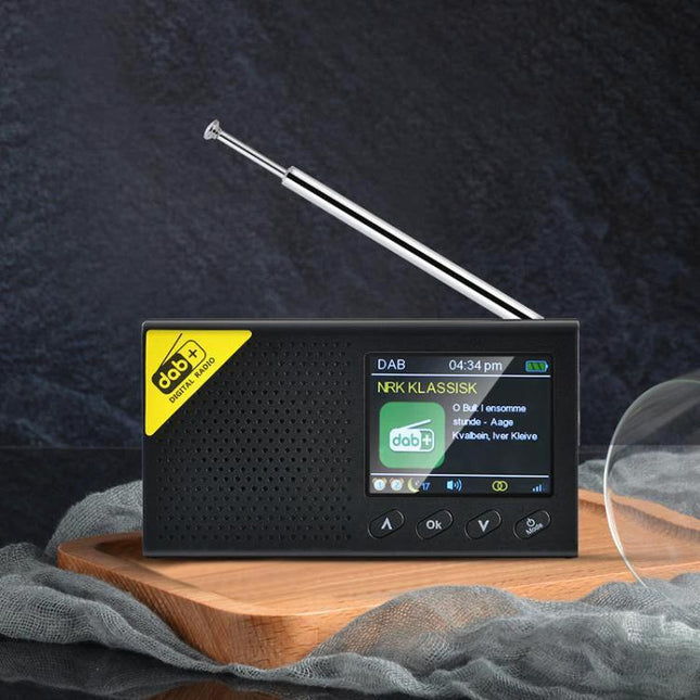 Compact Portable DAB Digital Radio for In-Car Listening - compact DAB radio with LCD display and telescopic antenna on wooden tray
