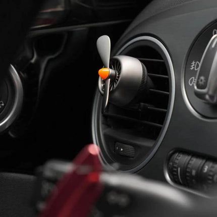 Bbdd Zinc Alloy Car Air Vent Air Freshener Ornament mounted on car vent, compact zinc alloy body with propeller design releasing subtle fragrance