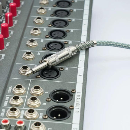 Cable for Connecting Guitar to Phone for Recording Sessions plugged into audio mixer, Type-C-ready guitar recording cable