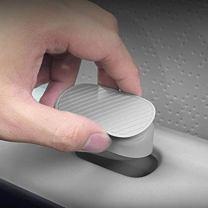 Leapmotor Passenger Side Silicone Plug For Sealing - gray silicone replacement plug being pressed into passenger-side opening to seal dust and moisture