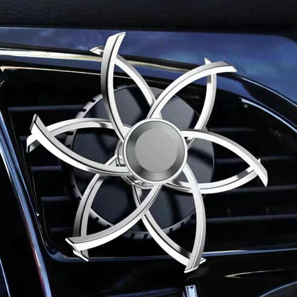 Car Air Vent Ornament Rotating Snowflake With Fragrance Pad mounted on car vent, silver rotating snowflake design for subtle scent and airflow-friendly fit