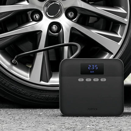 70mai Tire Inflator for Road Trips and Daily Driving - portable digital pump inflating a car tire on the roadside