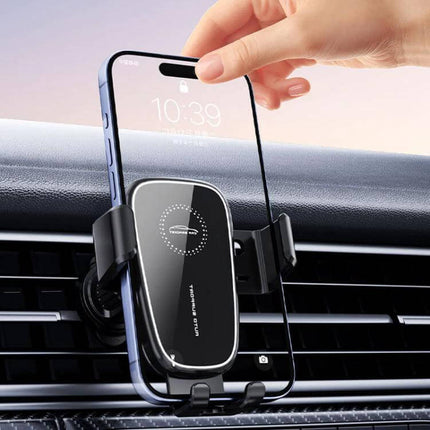 Car Air Vent Gravity Phone Mount For Driving With Anti Drop Tail Clip showing one-handed placement of a smartphone on a black vent-mounted gravity phone holder