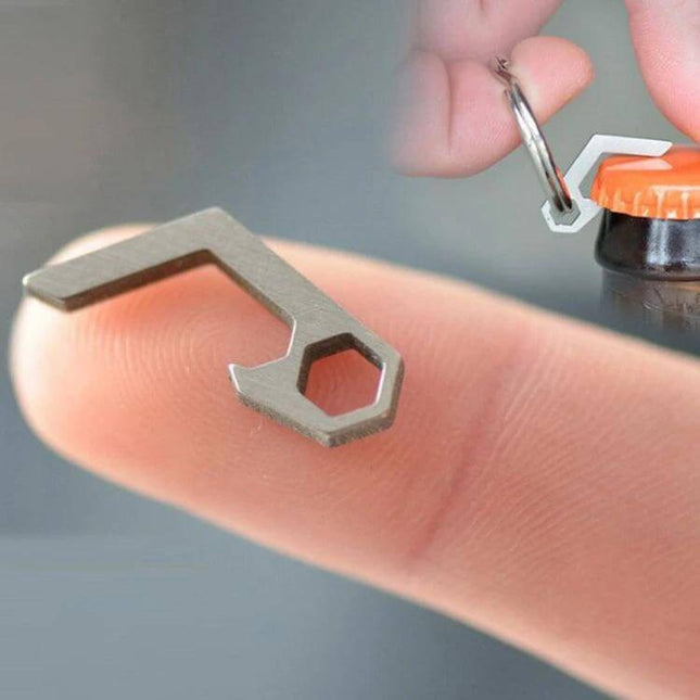 EDC Mini Bottle Opener Keyring Titanium Alloy For Camping And Hiking - compact stainless/GTC4 titanium keyring opener shown on fingertip unlocking bottle cap