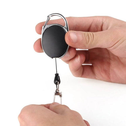 Outdoor Telescopic Wire Rope Key Ring Retractable EDC Keychain held in hand showing retractable 60cm nylon rope and carabiner clip
