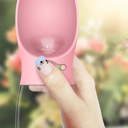 Convenient Water Dispenser for Pets on Outdoor Trips — portable pink squeeze bottle with attached bowl for hiking and park outings