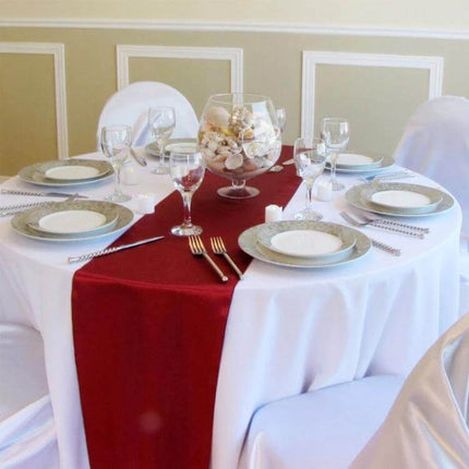 Satin Tablecloth 30x275 Cm For Weddings And Parties red runner on round banquet table with place settings and glass centerpiece