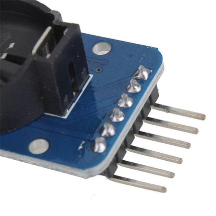 Real-Time Clock Module for Electronic Projects and Devices – close-up of DS3231 board with coin cell holder and header pins for IoT, data logging, and alarm systems