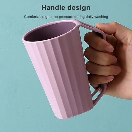 Bathroom Cup for Daily Toothbrushing with Handle pink grooved cup held by hand showing comfortable handle design