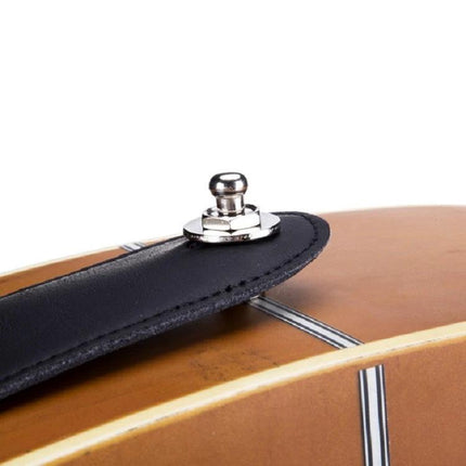 Essential Guitar Strap Lock for Daily Music Practice — close-up of chrome strap lock on black leather strap attached to acoustic guitar