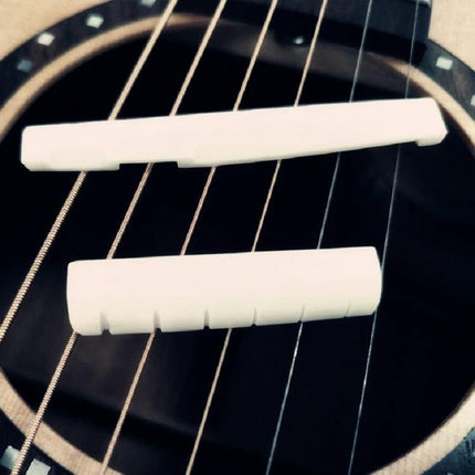 Ox Bone Pillows for Guitar Bridge in Daily Music Sessions placed on acoustic guitar strings to stabilize bridge and reduce vibrations