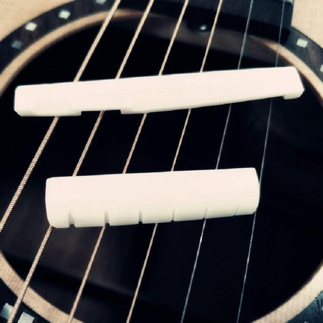 Ox Bone Pillows for Guitar Bridge in Daily Music Sessions placed on acoustic guitar strings to stabilize bridge and reduce vibrations