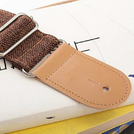 Comfortable Cotton Linen Strap for Everyday Guitar Sessions showing brown woven strap with leather end and metal buckle