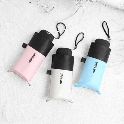 Compact Women's Folding Umbrella for Rain and Sun Protection - compact portable umbrellas in pink white and blue with wrist strap
