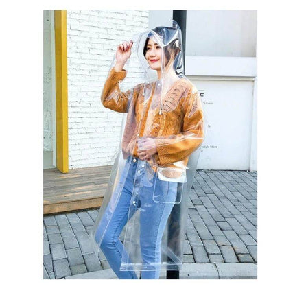 Transparent EVA Raincoat for Everyday Outdoor Protection - model wearing clear waterproof EVA raincoat with hood over casual outfit
