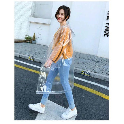 Transparent EVA Raincoat for Everyday Outdoor Protection - woman walking in clear waterproof EVA raincoat over casual outfit