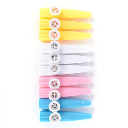 Colorful Plastic Kazoo for Children's Daily Music Fun - row of yellow white pink blue plastic kazoos for kids music play