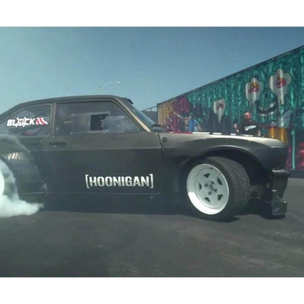HOONIGAN Fashion Racing Car Sticker for Vehicle Decoration, 19x7cm on black drift car showing HOONIGAN decal and tire smoke