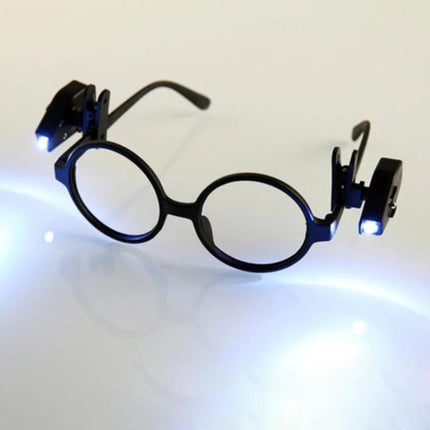 Clip-On Light for Glasses During Evening Reading Tasks - black clip-on LED lights attached to round glasses for focused late-night reading