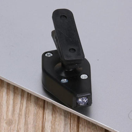 Clip-On Light for Glasses During Evening Reading Tasks - compact black clip-on LED light attached to glasses frame for focused night reading