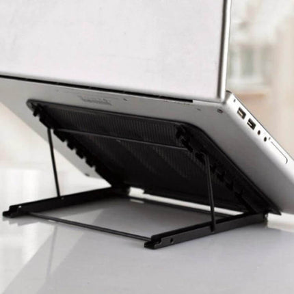 Portable Adjustable Ventilated Laptop Stand for Desktops supporting laptop at an ergonomic angle with metal mesh cooling surface