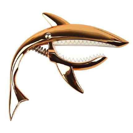 Shark-Shaped Capo for Everyday Guitar Music Sessions — gold shark-shaped capo on white background for quick key changes