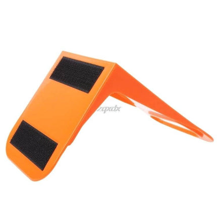Car Trunk Fixed Partition Bracket Keeps Items From Shifting — orange sticky-base trunk partition bracket to prevent bottles, suitcases, instruments shifting