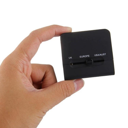 Compact Universal Dual USB Charger Adapter for Travel and Home Use shown in hand, compact travel plug with UK EU US AU options