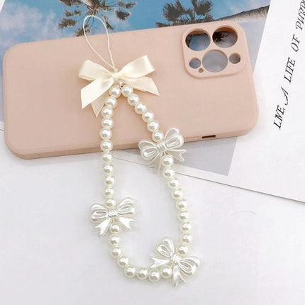 Versatile Handmade Butterfly Pearl Resin Phone Chain Accessory shown as a pearl lanyard with butterfly bows attached to a pink phone case