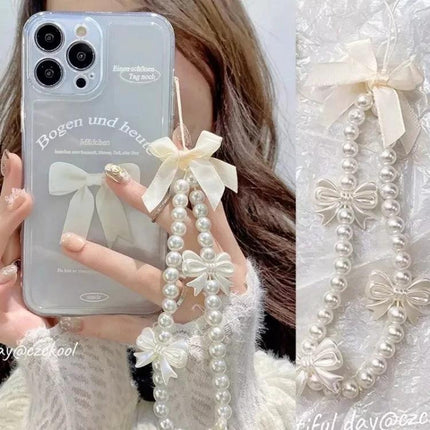 Versatile Handmade Butterfly Pearl Resin Phone Chain Accessory shown on clear phone case with cream bows and pearl beads