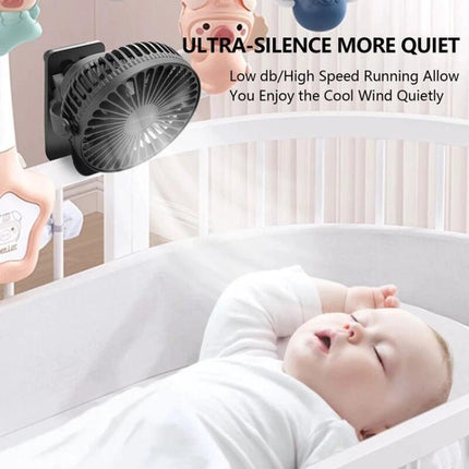 Compact USB-Powered Mini Clip Fan for Desk and Travel Use mounted on crib, ultra-silent cooling directed at sleeping baby