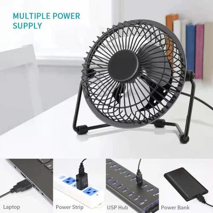 Compact USB Electric Fan for Desktop Cooling and Quiet Use on a desk USB-powered 5-inch black fan next to laptop, power strip, USB hub and power bank