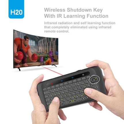 H20 Wireless Touchpad Keyboard for Everyday Computing Tasks compact wireless touchpad keyboard with full QWERTY held in hands controlling TV