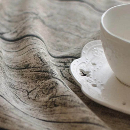 Tablecloth For Dining Tables 100X140 Cm Simple Everyday Use in gray wood-grain cotton-linen blend with oilproof woven surface and teacup on table