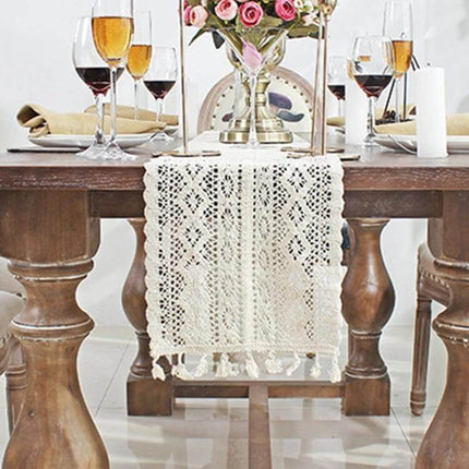 Tassel Lace Floral Table Runner Crochet Cotton Blend 24x180cm on wooden dining table with floral centerpiece and glassware