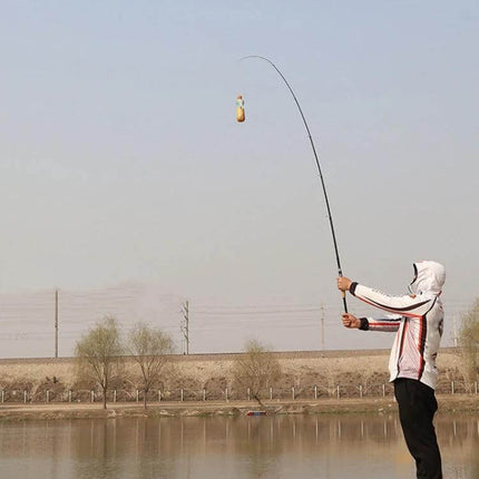 1.8m Telescopic Carbon Lure Rod For River And Lake Fishing - angler casting from shore with collapsed portable carbon lure rod and large guide eye