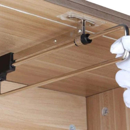 Telescopic Rail Pull Out Wardrobe Clothes Hanger 25cm installed under shelf showing metal rail, sliding guide and gloved hand pulling hanger