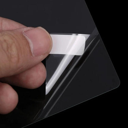 Tempered Glass Screen Protector For Thermomix Machines showing clear tempered glass being peeled and demonstrating oil‑resistant, scratch‑resistant film