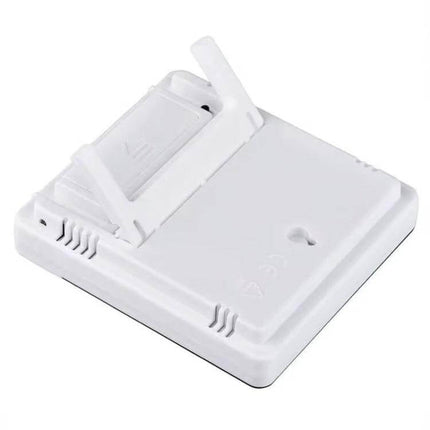 Thermometer Hygrometer Alarm Clock For Everyday Use compact white unit back view with fold-out stand and battery compartment