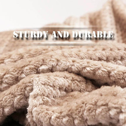 Thick Coral Fleece Blanket For Sofa, 200x230cm Warm plush coral fleece blanket draped on sofa highlighting soft, sturdy and durable texture